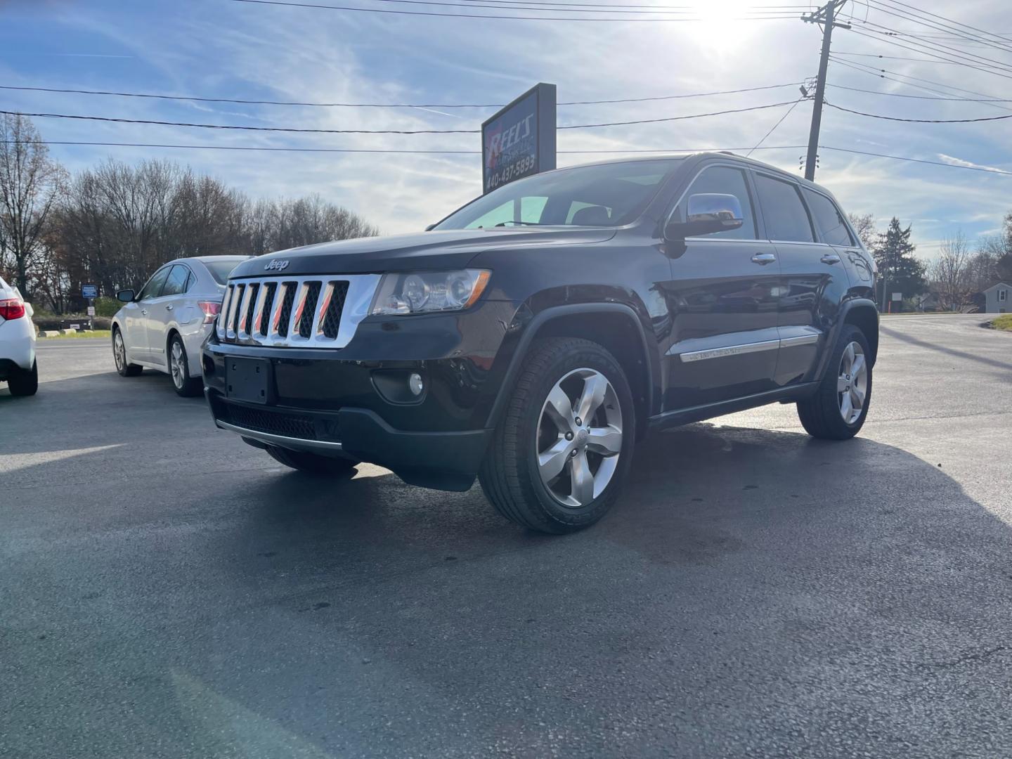 2013 Black /Gray Jeep Grand Cherokee (1C4RJFCG5DC) , located at 547 E. Main St., Orwell, OH, 44076, (440) 437-5893, 41.535435, -80.847855 - Photo#0